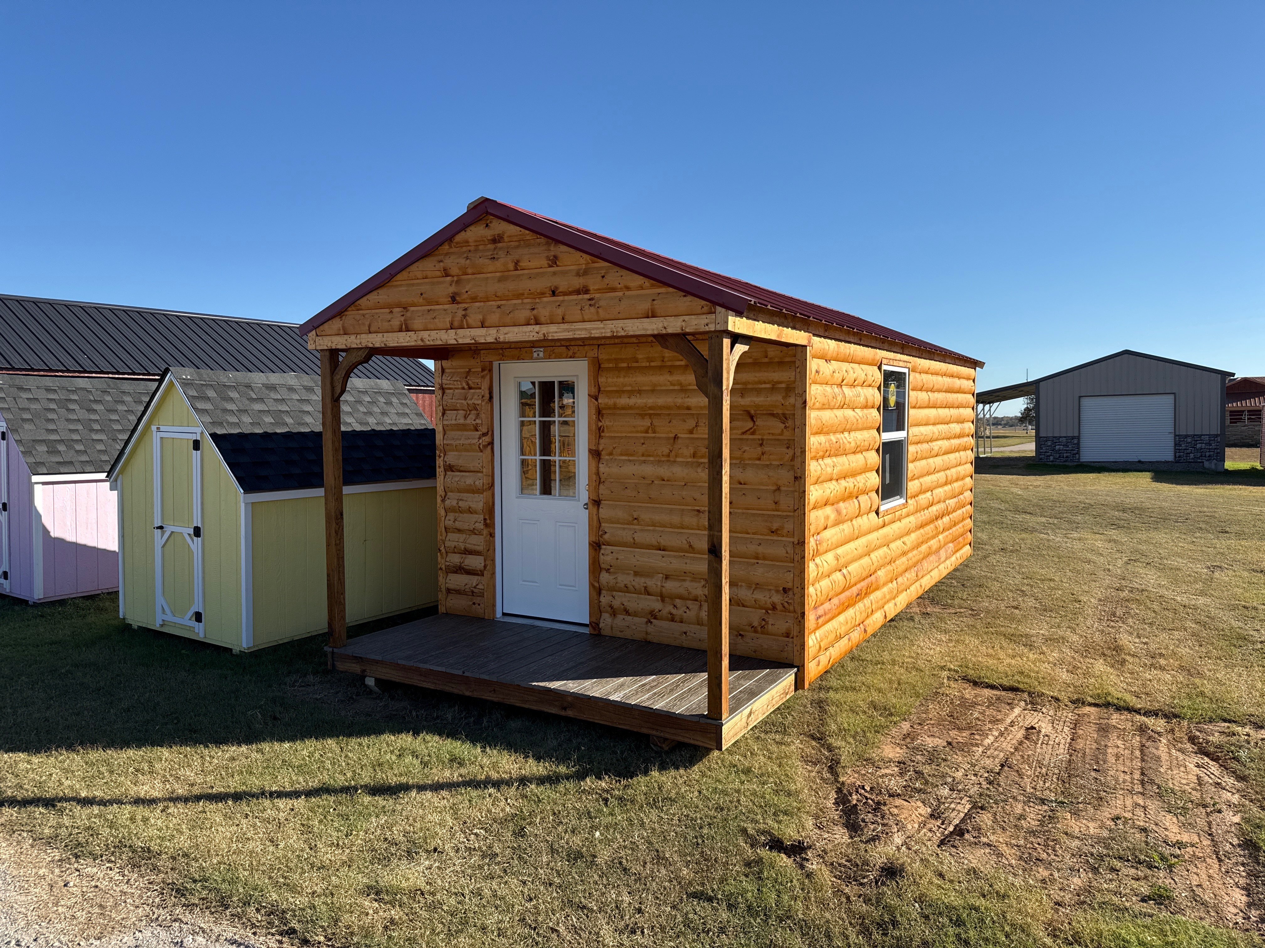 Metal Cottage Barn with log siding 10 x 24